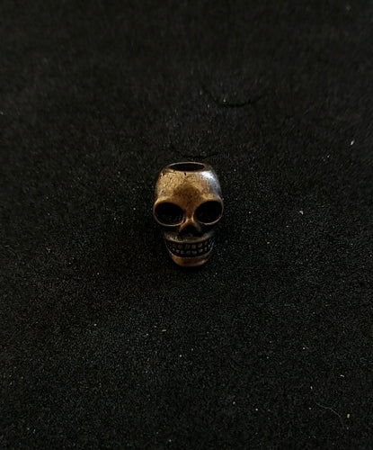 Small skull pewter bead (brass finish)